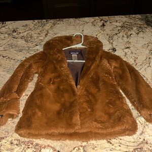 Patagonia brown faux fur jacket.